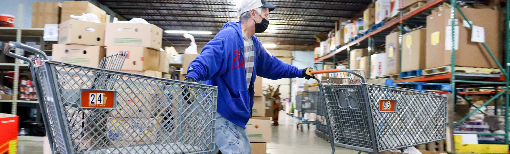 Todd moving shopping carts during distribution
