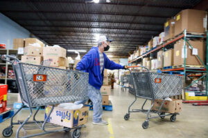 Todd moving shopping carts during distribution 