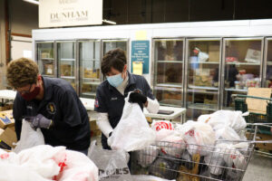 Marie Wienckowski bagging items for distribution